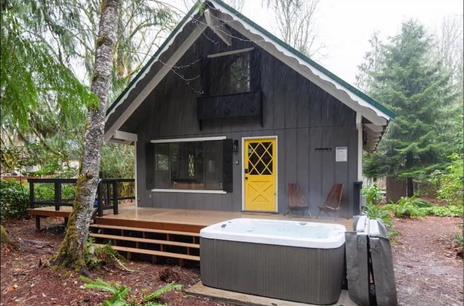 The completed newly built back porch leading to the hot tub and back yard