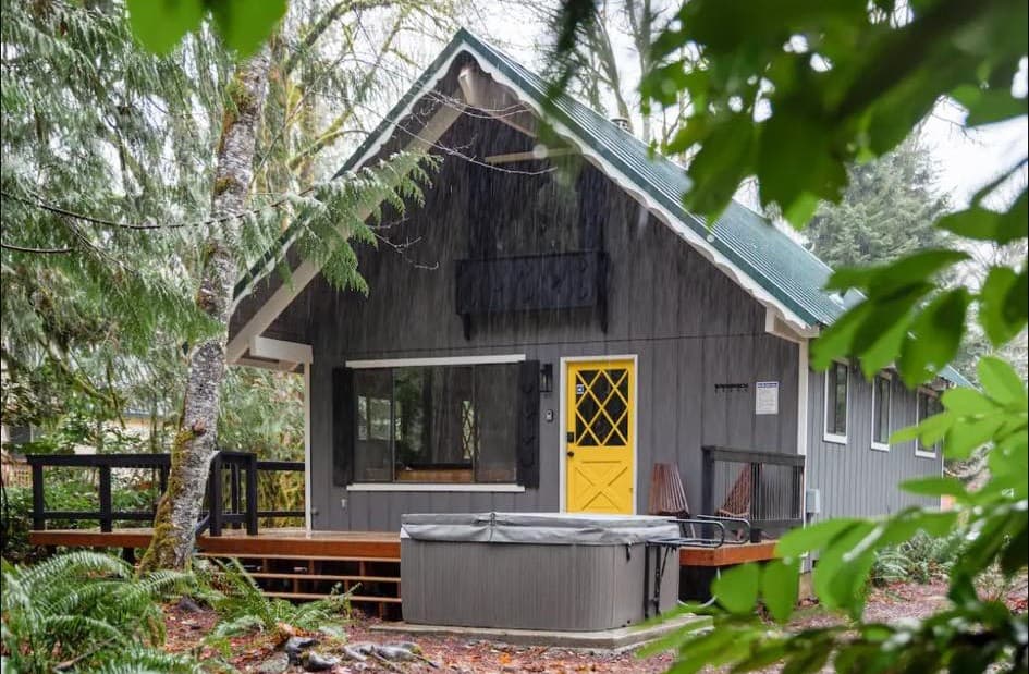 Newly renovated back deck with access to a hot tub